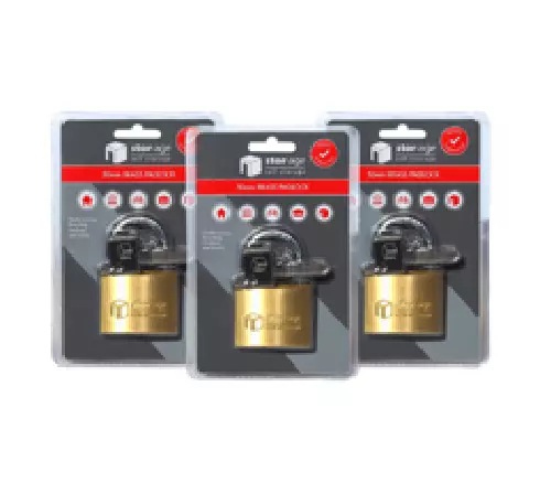 Three Stor-Age branded brass locks in packaging